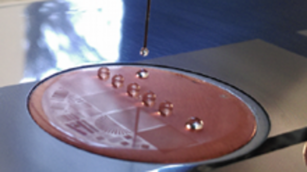 Microstructured nanocomposite coating with superhydrophobic properties, illustrated by water droplets.